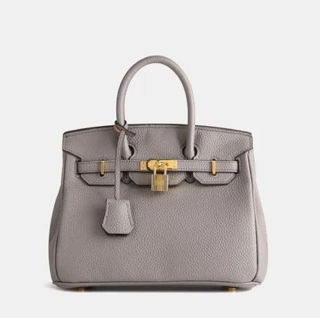 Borsa Birkin grigia in pelle con dettagli dorati, manico superiore e chiusura a lucchetto. Elegante accessorio di lusso per moda femminile.