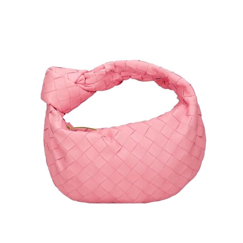 Borsa a spalla intrecciata rosa, design moderno, accessorio moda donna, tessuto elegante, perfetta per look casual e chic.