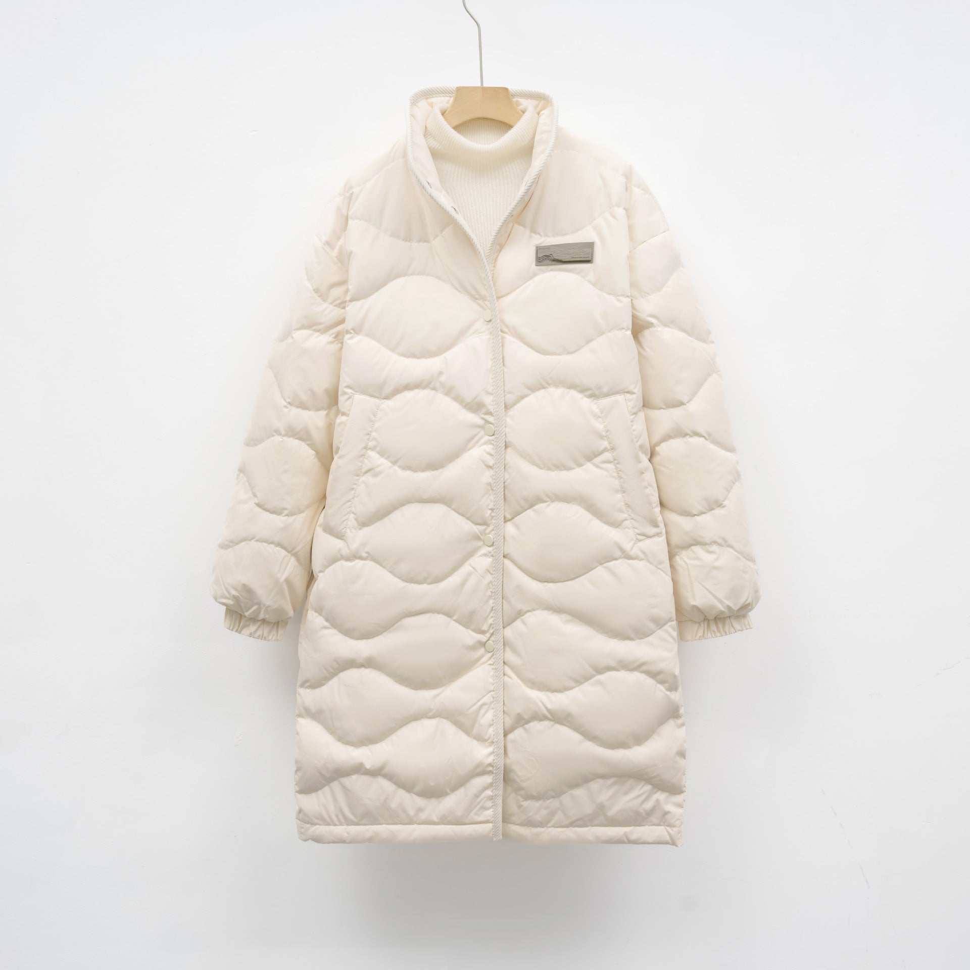 Lange Dames Winterjas – Gewatteerde Jas met Golvende Stiksels