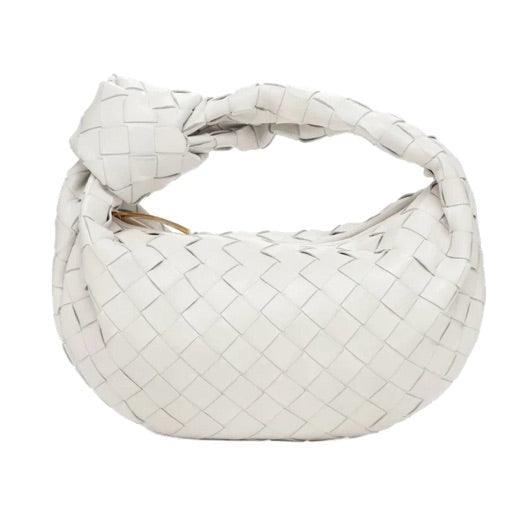 Borsa a mano intrecciata bianca, design moderno, pelle di alta qualità, accessorio moda elegante, perfetta per look sofisticati e casual.